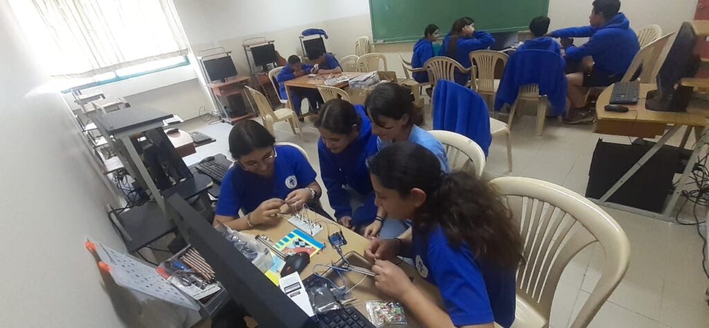 Students working on electronics in a school computer lab