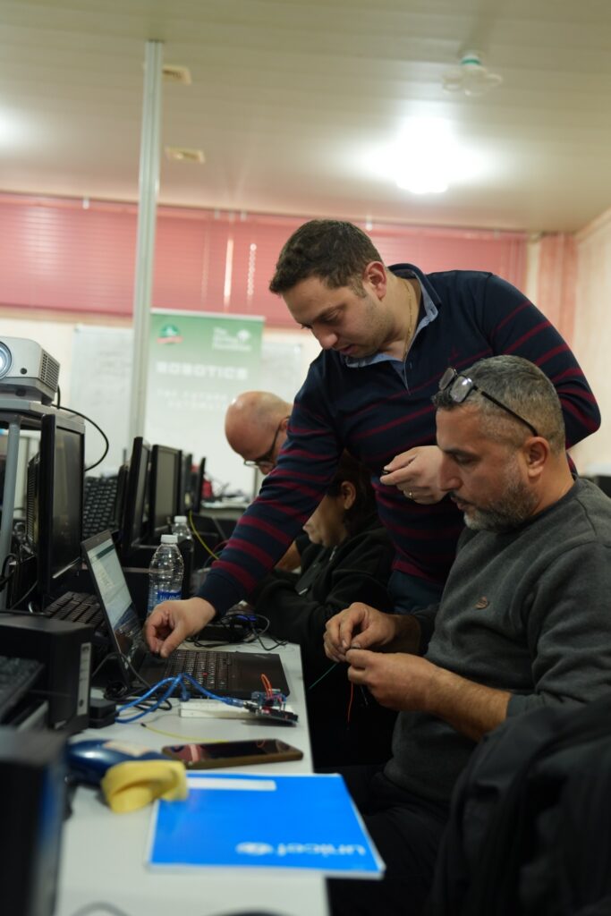Train-the-Trainer workshop where teachers learn Arduino programming