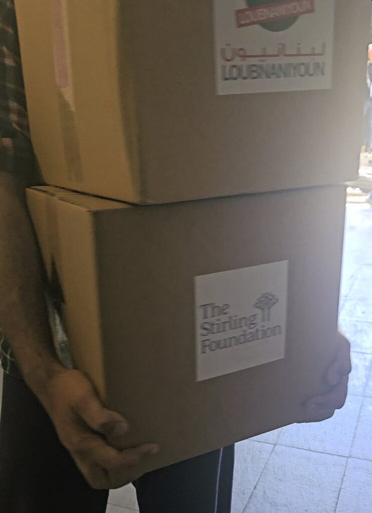 Aid boxes labelled Loubnaniyoun and the Stirling Foundation