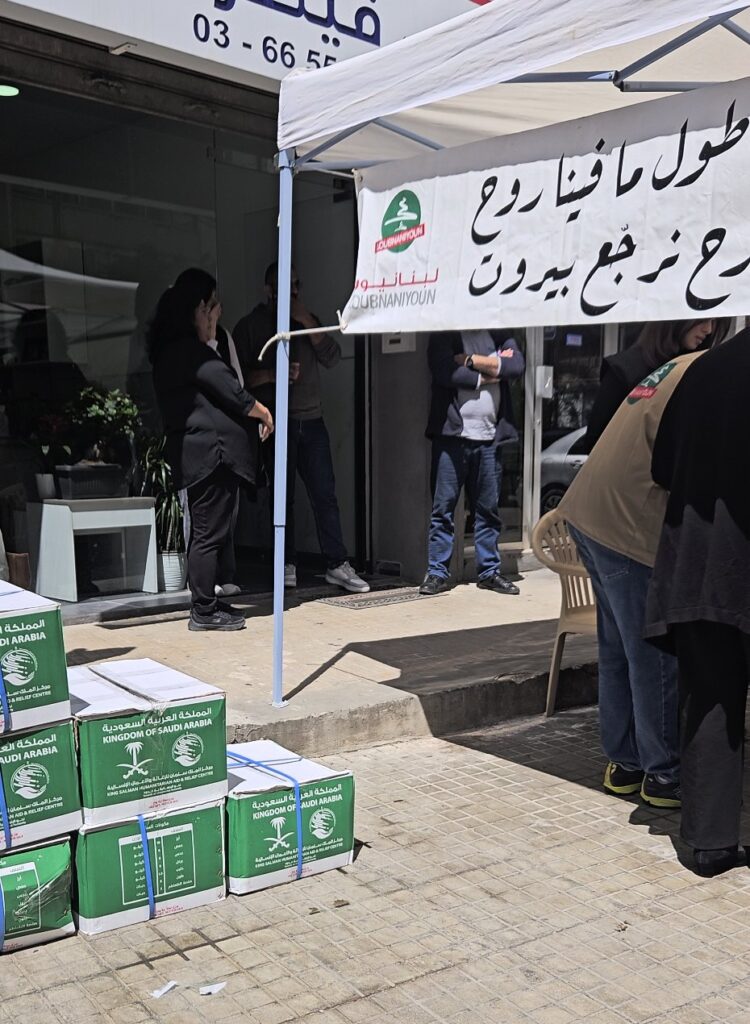 Food boxes stacked at the distribution point under the Loubnaniyoun banner